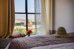 Postel nebo postele na pokoji v ubytování Kasbah Beldi