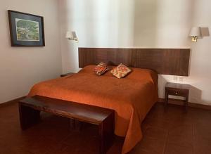 Postel nebo postele na pokoji v ubytování Hotel Posada Santa Rita