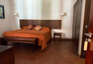 Postel nebo postele na pokoji v ubytování Hotel Posada Santa Rita