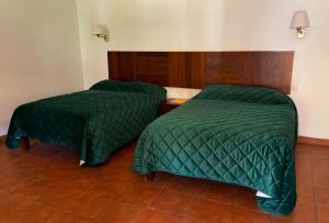 Postel nebo postele na pokoji v ubytování Hotel Posada Santa Rita