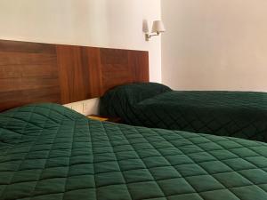 Postel nebo postele na pokoji v ubytování Hotel Posada Santa Rita