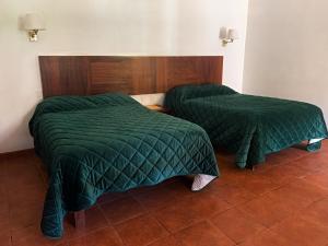 Postel nebo postele na pokoji v ubytování Hotel Posada Santa Rita