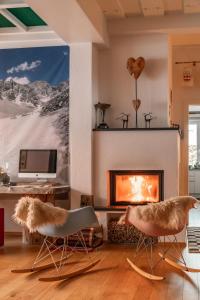Televízia a/alebo spoločenská miestnosť v ubytovaní Alpin Appartement Reinhard Tritscher