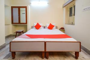 Ένα ή περισσότερα κρεβάτια σε δωμάτιο στο Super Hotel O Anand Hotel Jodhpur +41 φωτογραφίες