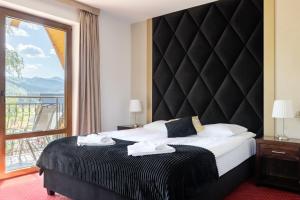 Posteľ alebo postele v izbe v ubytovaní Dworek pod Giewontem - Jacuzzi & Sauna