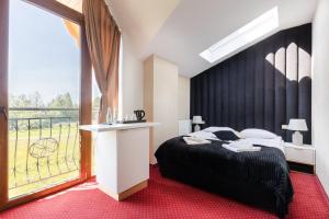Posteľ alebo postele v izbe v ubytovaní Dworek pod Giewontem - Jacuzzi & Sauna