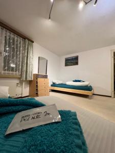Voodi või voodid majutusasutuse Hotel Péz Ault toas