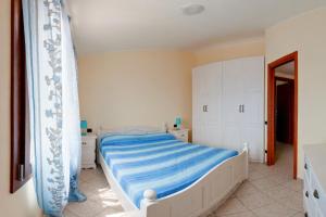 Una cama o camas en una habitación de Casa Vacanze Porto Corallo