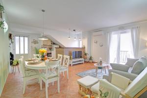 a living room with a table and a dining room at Apartment Lana in Dubrovnik