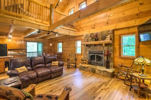 A seating area at Scenic Trade Cabin with Deck Near Boone and App State!
