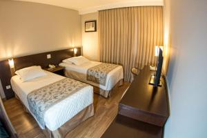 Postel nebo postele na pokoji v ubytování Hotel Campo Largo Comfort