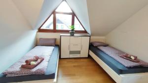 Postel nebo postele na pokoji v ubytování Apartmaji Dora