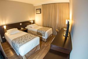 Postel nebo postele na pokoji v ubytování Hotel Campo Largo Comfort