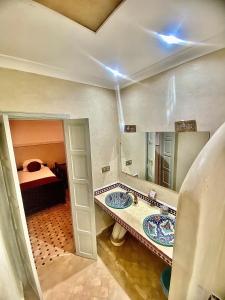 Postel nebo postele na pokoji v ubytování Riad magnolia privé