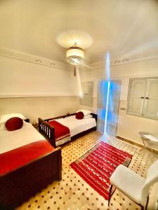 Postel nebo postele na pokoji v ubytování Riad magnolia privé
