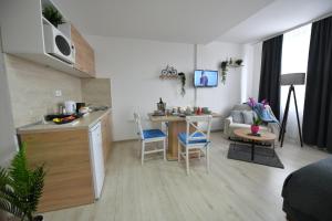Kjøkken eller kjøkkenkrok på West in apartments