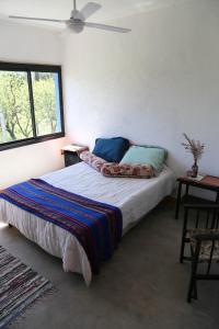 Ένα ή περισσότερα κρεβάτια σε δωμάτιο στο Casa Relax Potrero de Garay
