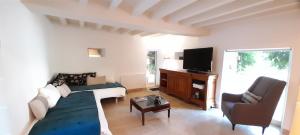 Μια τηλεόραση ή/και κέντρο ψυχαγωγίας στο Domaine de Vaufleury - La Maison de l'Escuiller