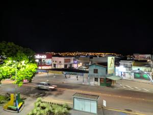 a night view of a city with a street at Hotel Goytacá in Paragominas