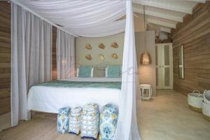 Tempat tidur dalam kamar di Mahona Boutique Hotel