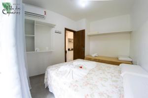 Katil atau katil-katil dalam bilik di Vila dos Coqueiros
