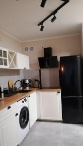 Kuchyňa alebo kuchynka v ubytovaní Apartament Piaskowy Perłowa Przystań Kołobrzeg