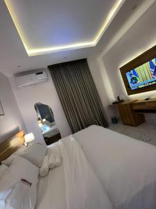 A bed or beds in a room at Bricks Residence