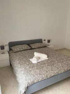 Кровать или кровати в номере Appartamento - Isola