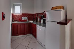 Kuchyňa alebo kuchynka v ubytovaní Vis a Vis Apartments