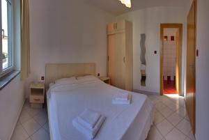 Posteľ alebo postele v izbe v ubytovaní Vis a Vis Apartments