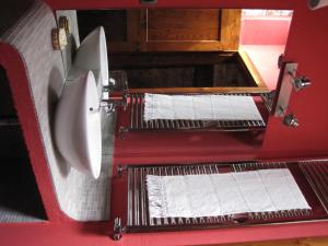 a red machine with two rolls of paper in it at Locanda La Campana in Agnone