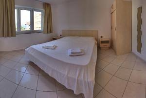 Posteľ alebo postele v izbe v ubytovaní Vis a Vis Apartments