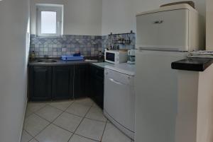 Kuchyňa alebo kuchynka v ubytovaní Vis a Vis Apartments