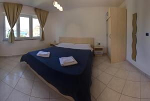 Posteľ alebo postele v izbe v ubytovaní Vis a Vis Apartments