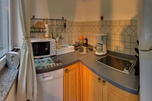 Kuchyňa alebo kuchynka v ubytovaní Vis a Vis Apartments