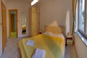 Posteľ alebo postele v izbe v ubytovaní Vis a Vis Apartments