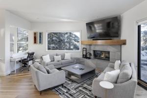 a living room with two couches and a fireplace at Snowmass 3 Bedroom Private Hot Tub in Snowmass Village