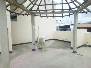 an empty room with a metal roof and a building at HOTEL en MONTERIA CITY in Montería