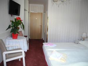 Postel nebo postele na pokoji v ubytování Hotel Rosner