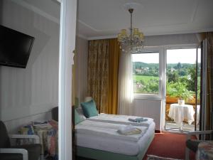 Postel nebo postele na pokoji v ubytování Hotel Rosner