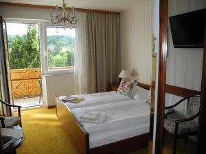 Postel nebo postele na pokoji v ubytování Hotel Rosner