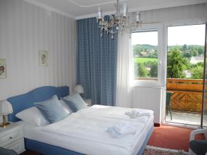 Postel nebo postele na pokoji v ubytování Hotel Rosner