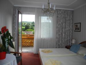 Postel nebo postele na pokoji v ubytování Hotel Rosner