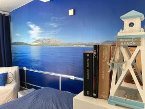 a bedroom with a view of the ocean on a cruise ship at CasaBarco in Costa Del Silencio