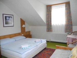 Postel nebo postele na pokoji v ubytování Hotel Rosner