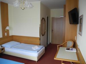 Postel nebo postele na pokoji v ubytování Hotel Rosner