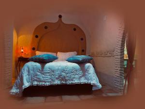 Posteľ alebo postele v izbe v ubytovaní Casas cueva El Castaño