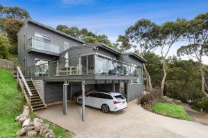 a house with a car parked in front of it at Summerhills House - BYO Linen in Lorne
