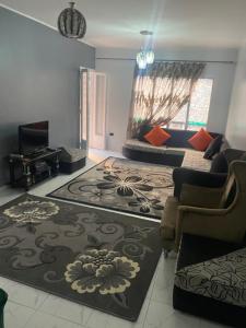 a living room with a couch and a living room at A lovely apartment for rent in Cairo