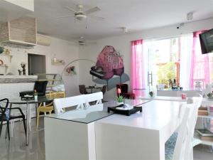 a kitchen and living room with a table and chairs at Art Villa in Punta Cana